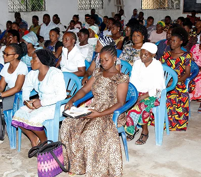 Congregation seated in rows listening during a service